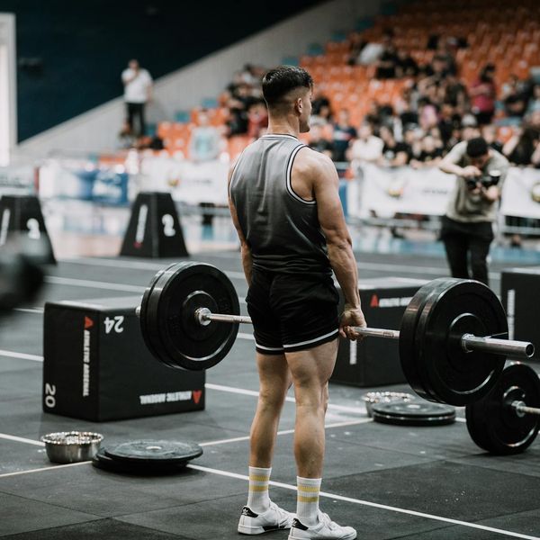 Man performing a static strength hold exercise.