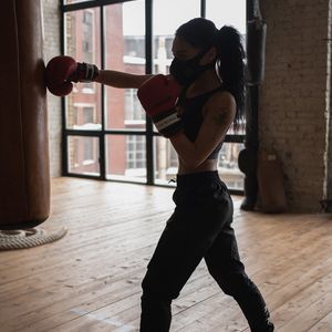 Man's focused face during a difficult part of the workout.